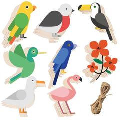 Set of colorful bird-shaped wooden toys with a floral branch and twine on a white background