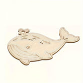 Wooden whale puzzle on a white background
