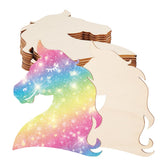 Unicorn-shaped wooden cutouts with a rainbow gradient on a white background