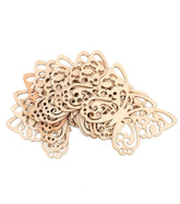 Wooden decorative pieces with intricate cut-out designs on a white background