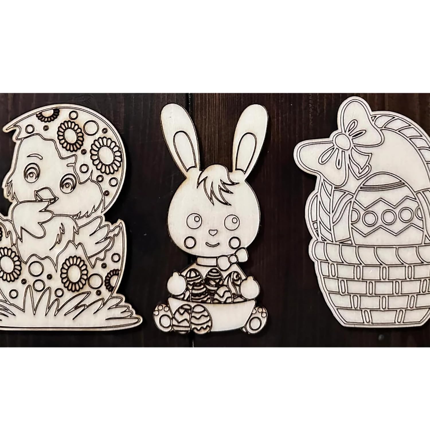 Three Easter-themed cutouts including a bunny, an egg, and a basket on a wooden background.