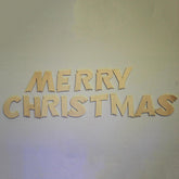 Wooden 'Merry Christmas' letters on a light background