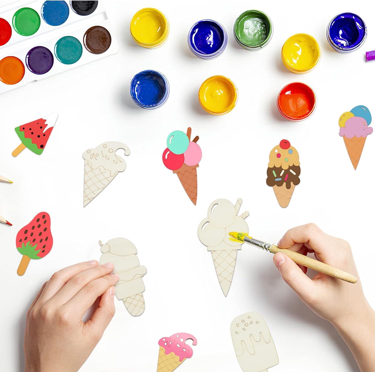 Children painting ice cream cone shapes with colorful paint and watermelon popsicle on a white background.