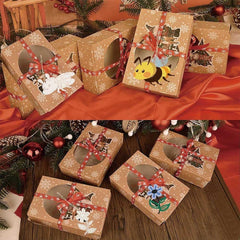 Decorative gift boxes with festive designs on a red and wooden surface.