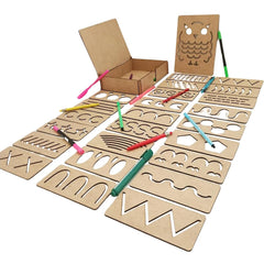Set of cardboard stencils with drawing tools on a white background