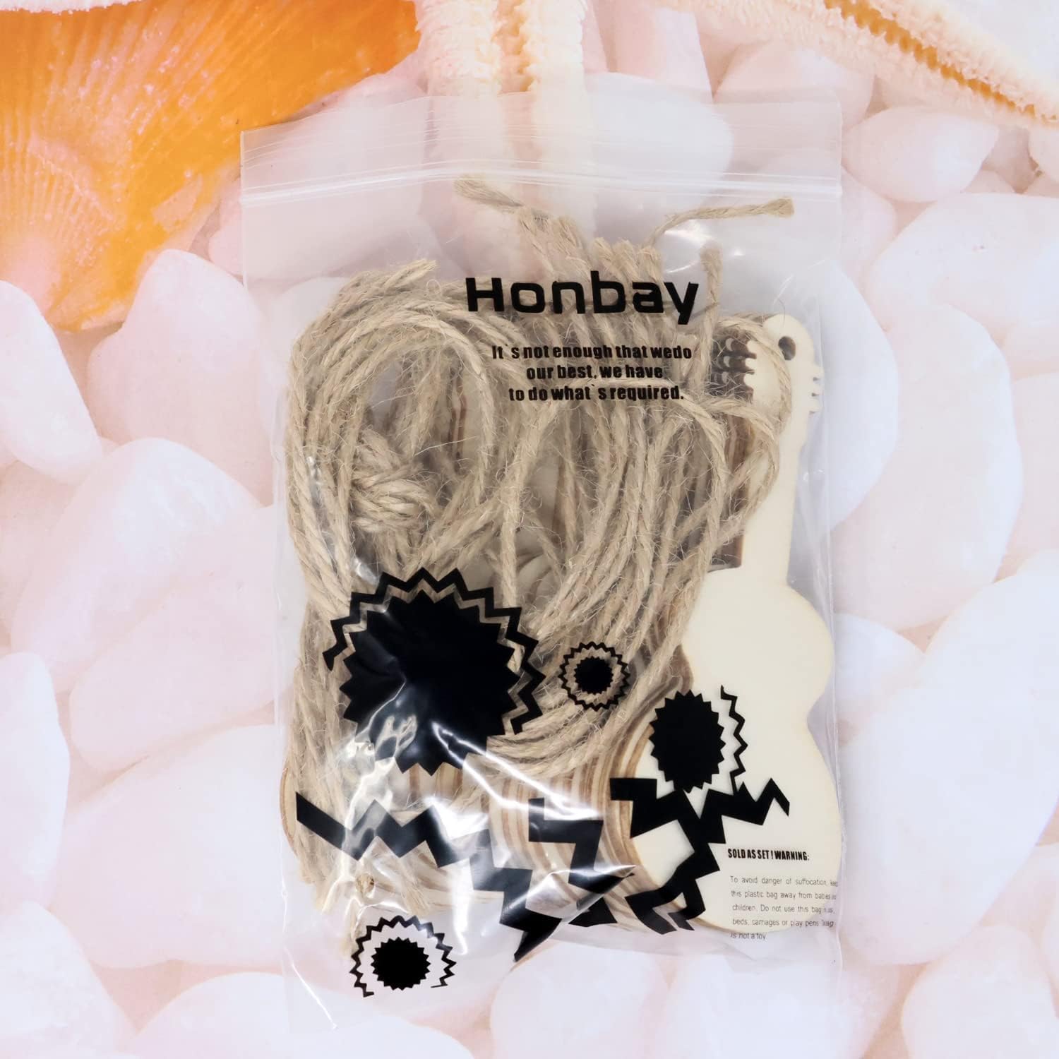 Honbay product packaging with yarn and a brush on a soft pink background