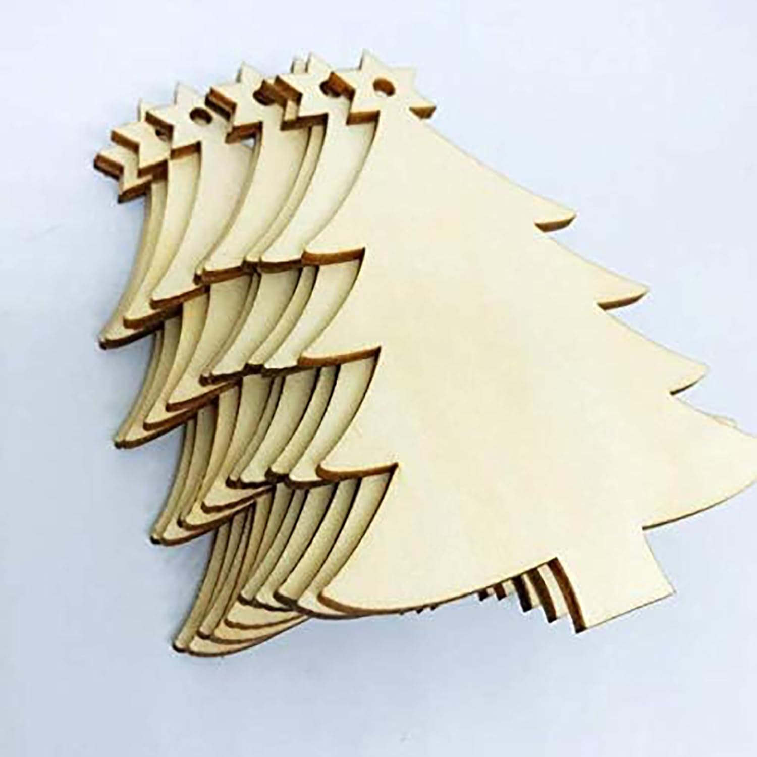 Set of wooden Christmas tree shapes on a light gray background