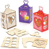 Set of wooden heart-shaped lanterns in various colors with unassembled pieces on a white background.