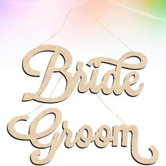 Wooden 'Bride' and 'Groom' signs on a colorful background