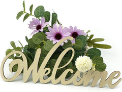 Decorative 'Welcome' sign with flowers and greenery on a white background