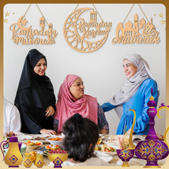 Three women sitting at a table with Ramadan decorations and 'Ramadan Kareem' signs.