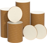 Stacks of brown paper plates with white centers on a white background