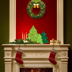 Decorative Christmas mantel with wreath, trees, candles, and stockings.