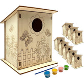 Wooden birdhouse kit with paint supplies on a white background