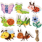 Set of colorful insect-shaped wooden toys with string on a white background