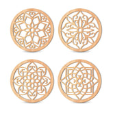 Four wooden coasters with intricate geometric patterns on a white background