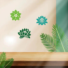 Decorative wall stickers of green and blue lotus flowers on a beige wall with wooden shelf and leaves.