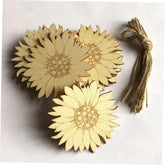 Three sunflower-shaped wooden coasters with a string on a white background