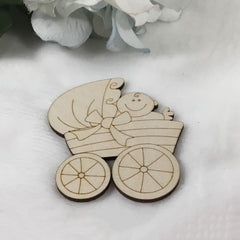 Wooden baby carriage ornament with a baby inside on a white background