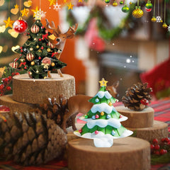 Decorative Christmas trees and deer figurines on a festive background
