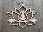 Wooden lotus flower wall art with a silhouette of a meditating figure on a wooden background