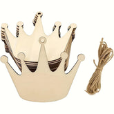 Wooden crown-shaped decorations with string on a white background