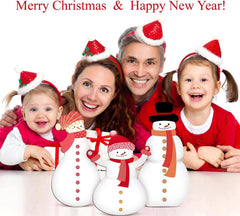 Family with children wearing Christmas hats with snowmen in front, text 'Merry Christmas & Happy New Year'.