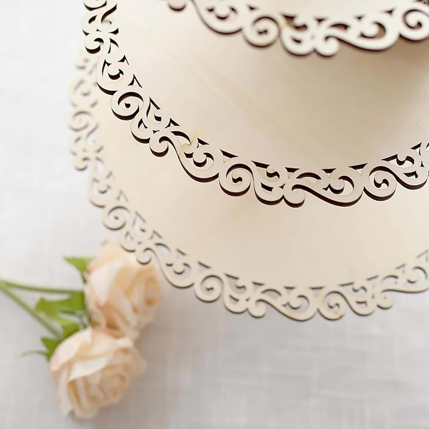 Decorative cake with intricate lace detailing on a white background