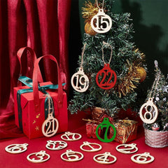 Advent calendar with numbered wooden ornaments on a red surface and Christmas tree.