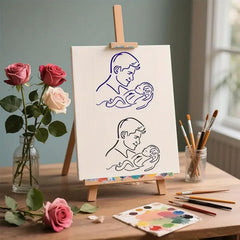 Easel with line drawings of a mother and child, surrounded by roses and painting supplies on a wooden table.