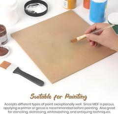 Person painting a wooden board with a brush, surrounded by paint containers and tools on a white surface.