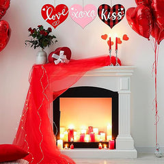 Valentine's Day decorated room with fireplace, balloons, and candles.