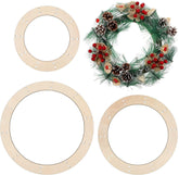 Three wooden wreath frames with a completed wreath featuring greenery, berries, and pinecones on a white background.