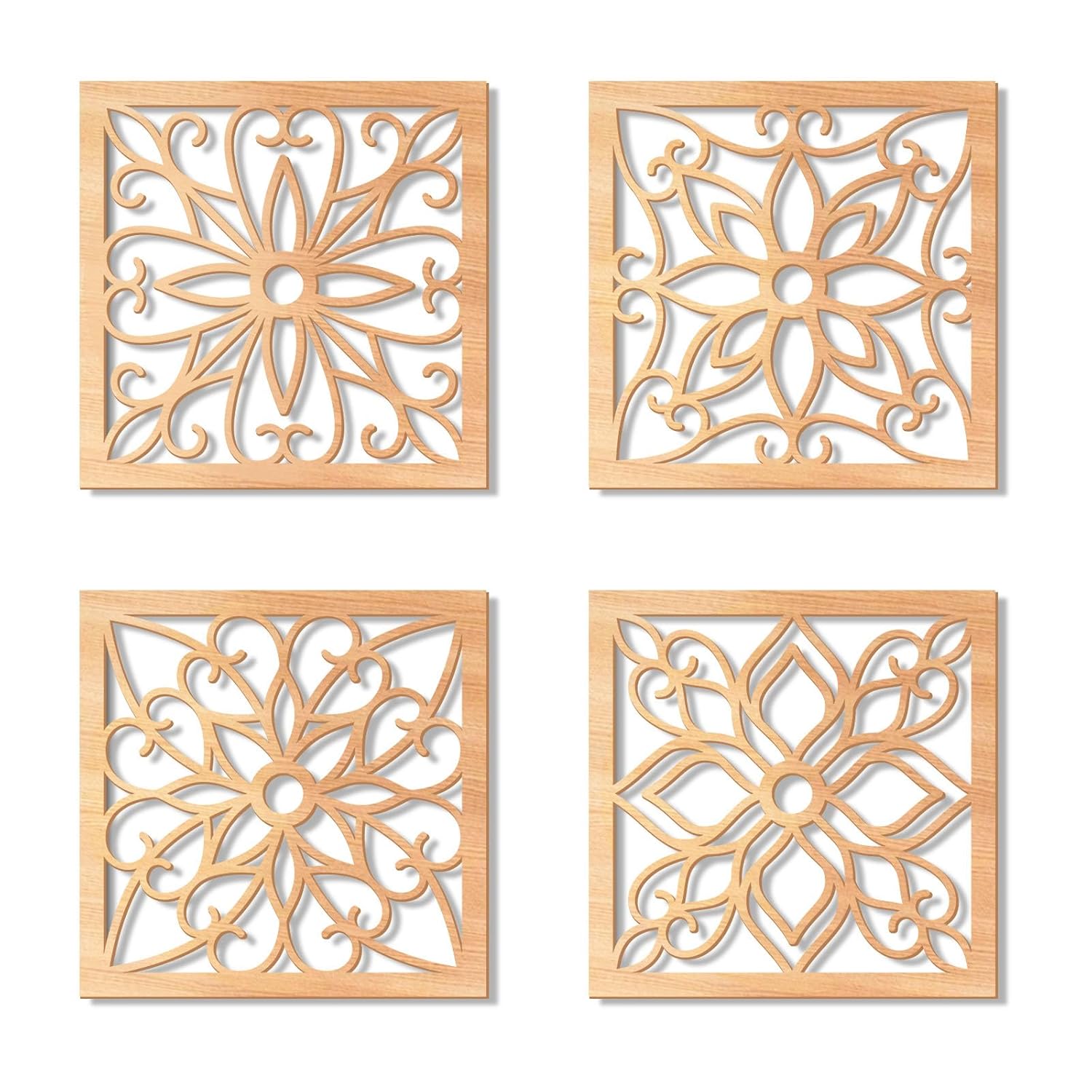 Four wooden decorative tiles with intricate cut-out patterns on a white background