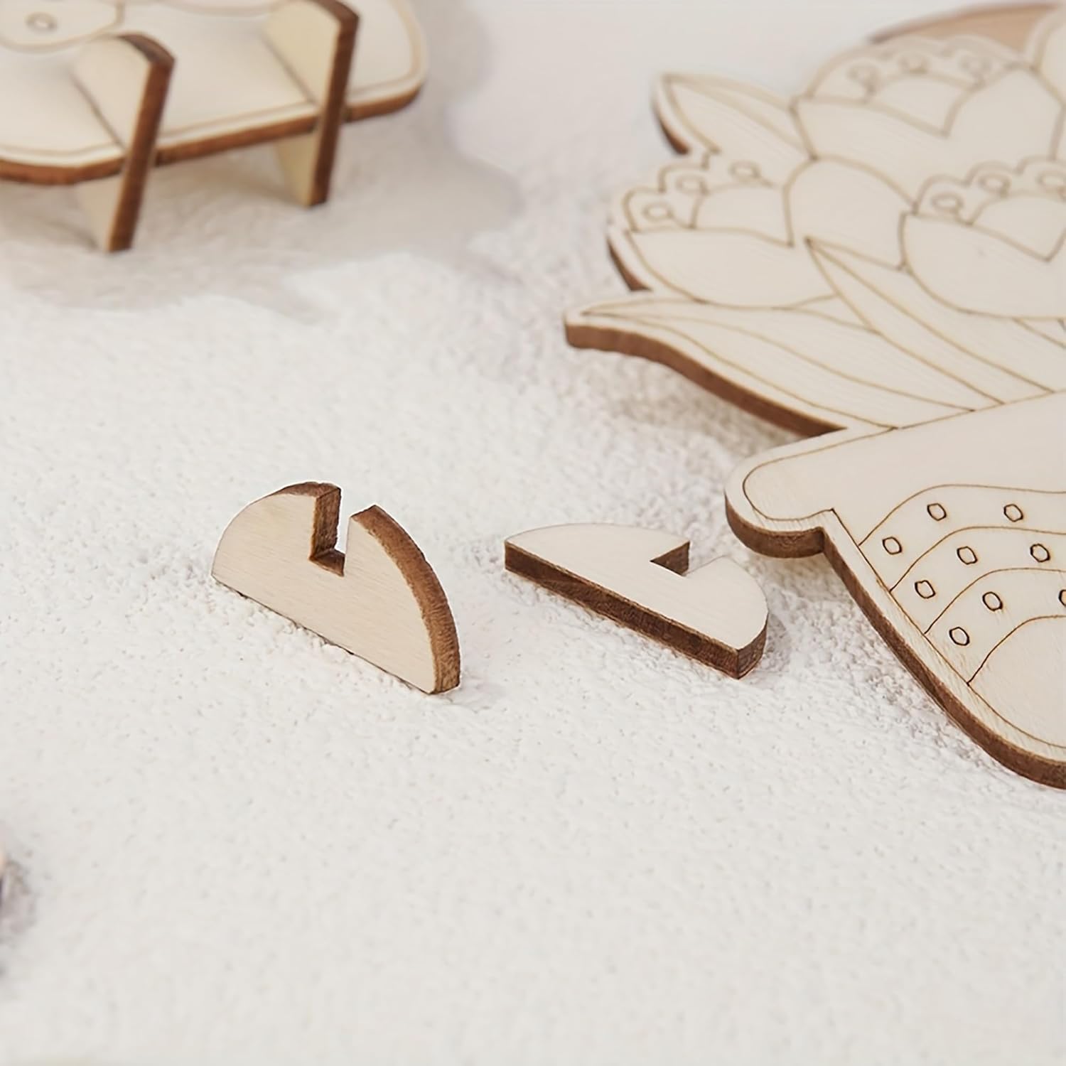 Wooden puzzle pieces on a white surface