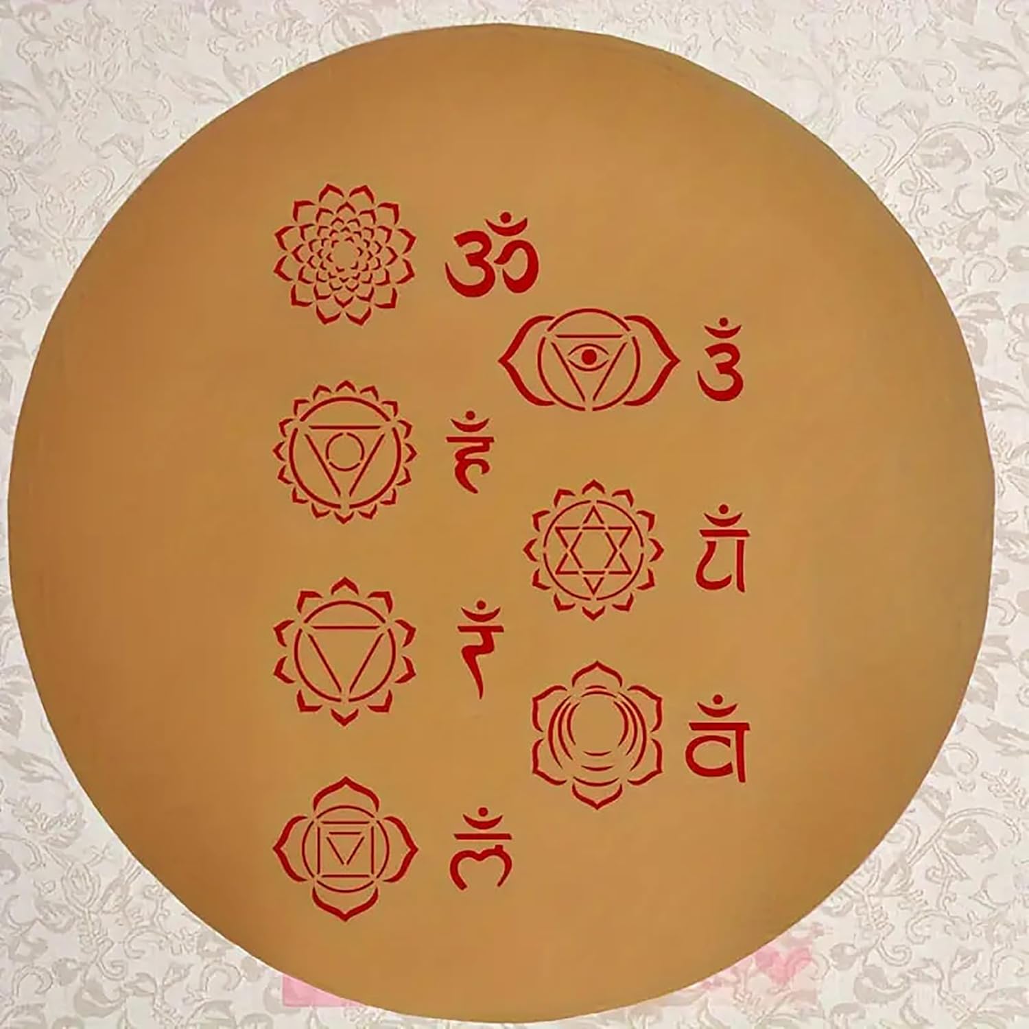 Circular brown board with red symbols and text on a textured white background