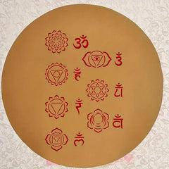 Circular brown board with red symbols and text on a textured white background