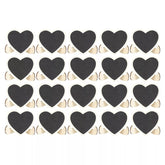 Pattern of black hearts with gold outlines on a white background