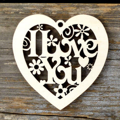 Heart-shaped wooden cutout with 'I Love You' text on a wooden background