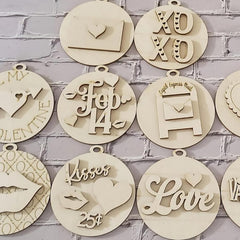 Decorative wooden ornaments with various designs and text on a brick wall background