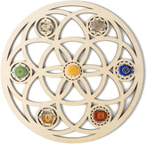 Decorative wall art with circular design and colored stones on a beige background