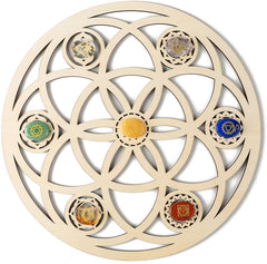 Decorative wall art with circular design and colored stones on a beige background