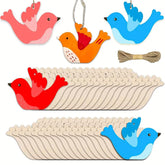 Set of wooden bird-shaped cutouts with colorful examples on a white background