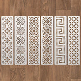 Set of six decorative wall panels with intricate patterns on a wooden floor.