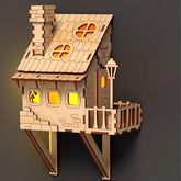 Wooden model of a house with a dark background