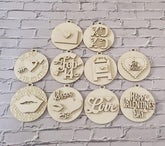 Decorative wooden tags with Valentine's Day phrases on a brick wall background
