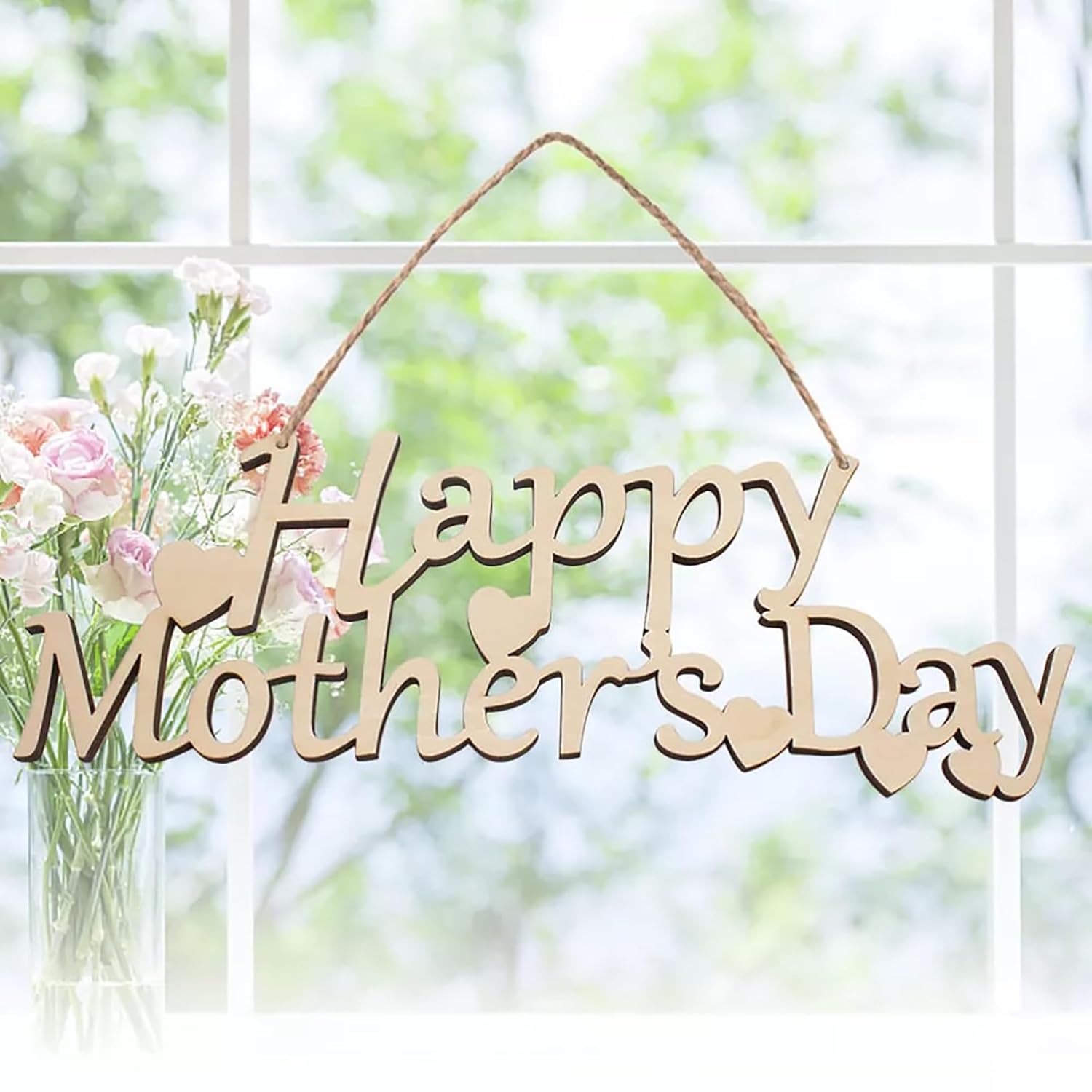 Wooden 'Happy Mother's Day' sign with flowers in the background