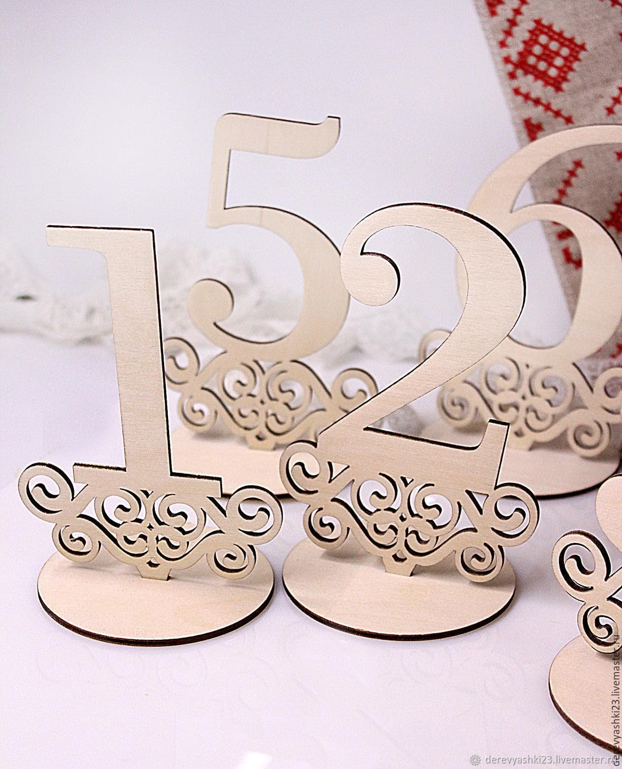 Decorative wooden table numbers on a white background