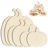 Set of wooden pumpkin-shaped cutting boards with 'Happy Thanksgiving' tags on a white background