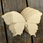 Wooden butterfly decoration on a wooden background